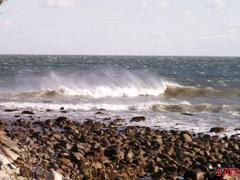 Wind battling waves on Peggotty Beach, Scituate